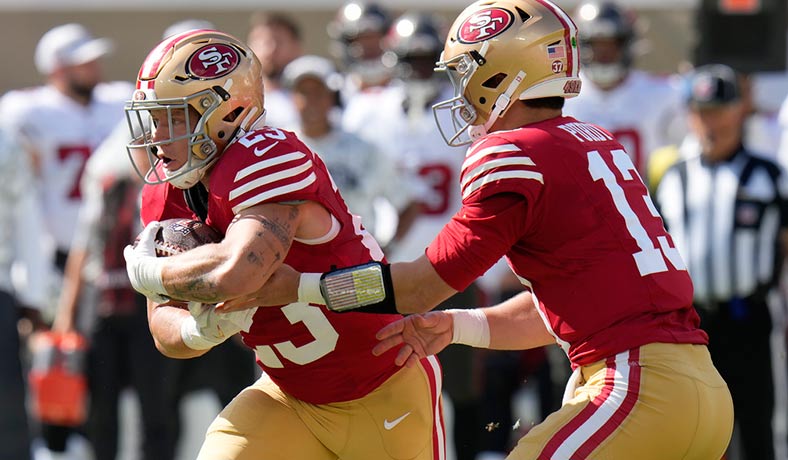 Brock Purdy y Christian McCaffrey en acción para los 49ers