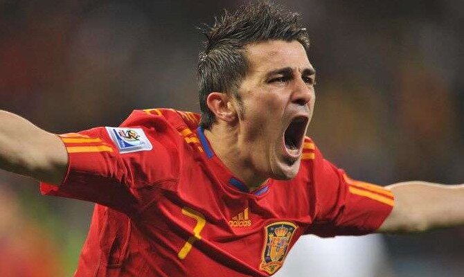 David Villa celebra un gol con la camiseta de España. Conoce los pronósticos del España vs Italia.